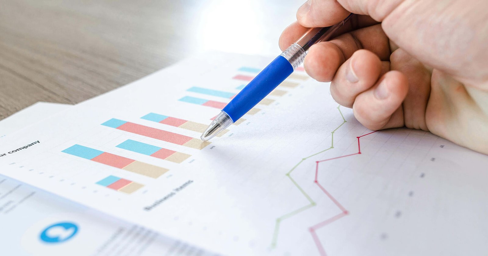 Remodeling contractor utilizing Google Ads and local SEO on a laptop, with a renovated kitchen project in the background, illustrating effective digital marketing strategies for remodeling services.